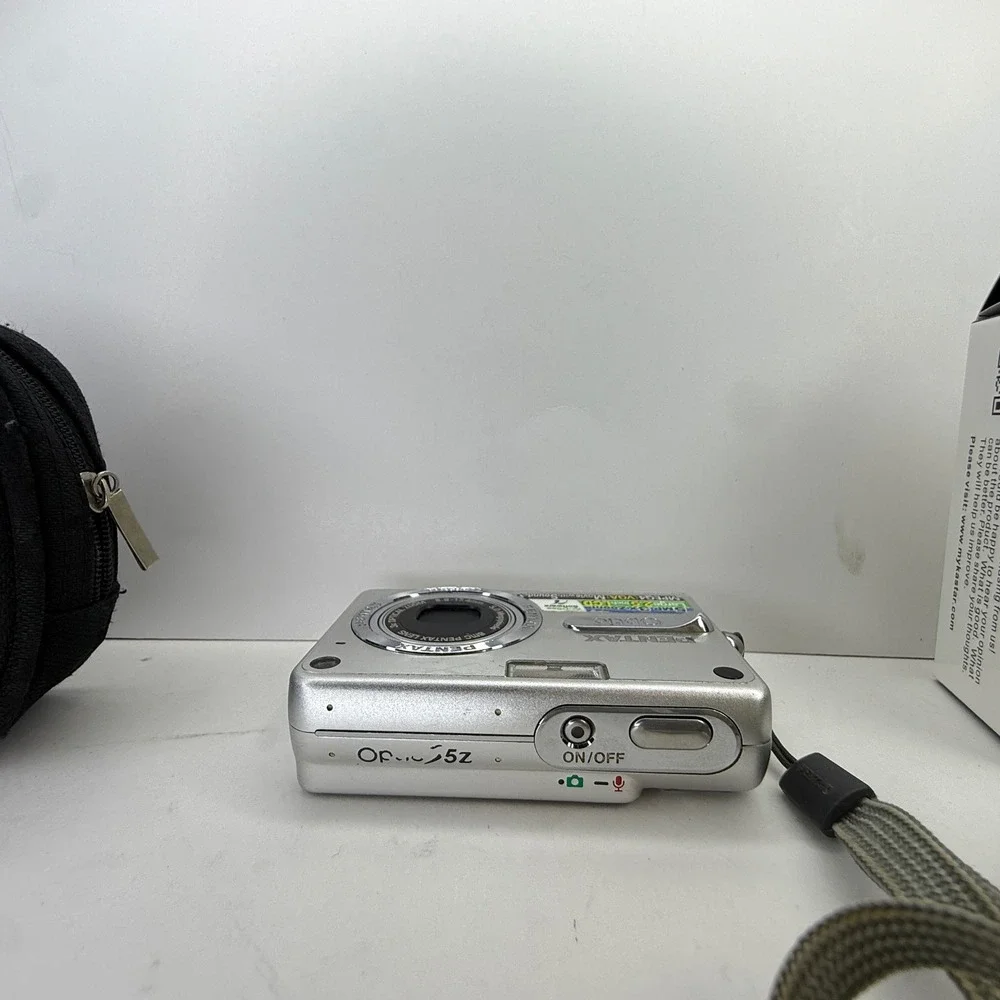 Pentax Optio S5z Silver Digital Camera 5.0MP 3x Zoom Bundle with Charger‎ Case